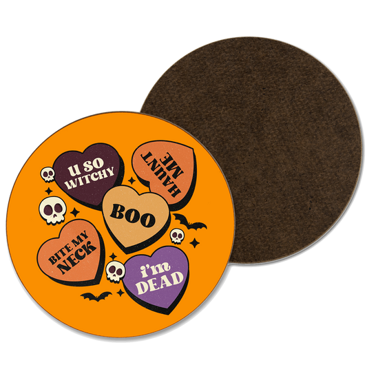 An orange coaster with multiple hearts with spooky phrases 