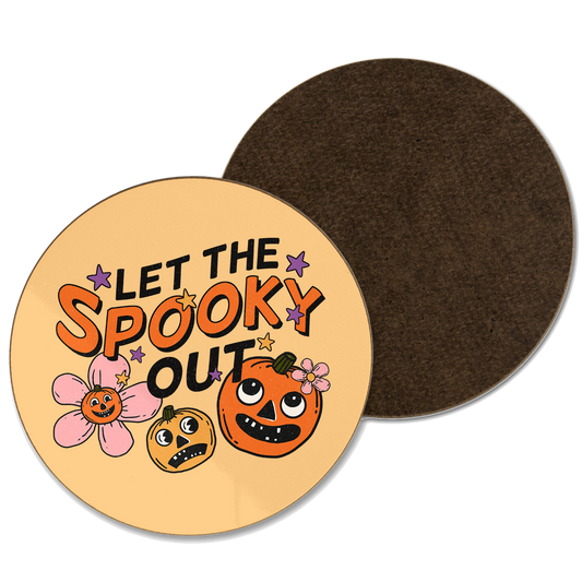 An orange coaster with ‘let the spooky out’ written with a pumpkin illustration 