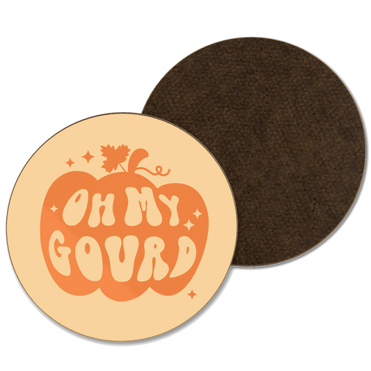 An orange coaster with ‘oh my gourd’ written out of a pumpkin illustration 