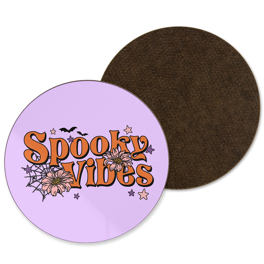 A purple coaster with spooky vibes written with cobweb illustrations