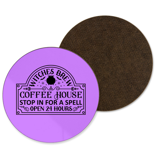 A purple coaster with Witches Brew coffee logo written